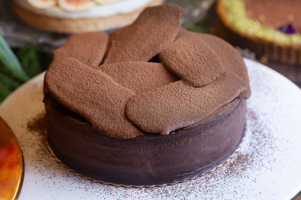 Bolo de cacau com damasco e laranja