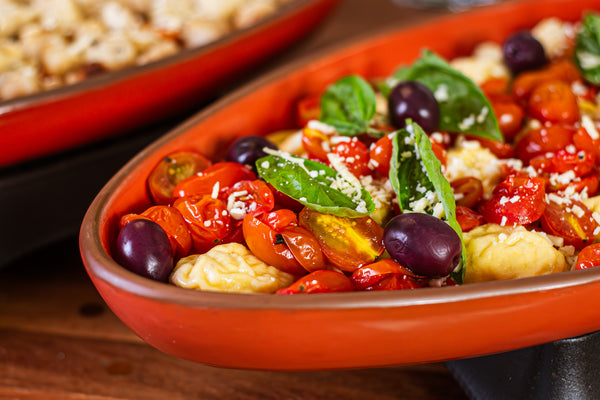 Raviolone de Bacalhau com azeitonas e tomatinhos confit