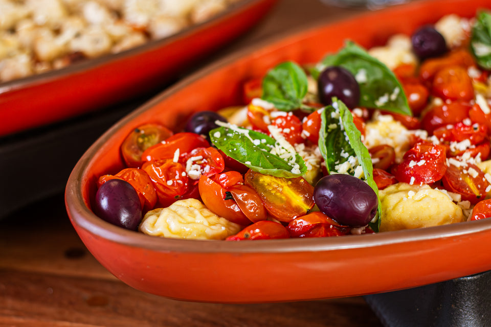 Raviolone de Bacalhau com azeitonas e tomatinhos confit