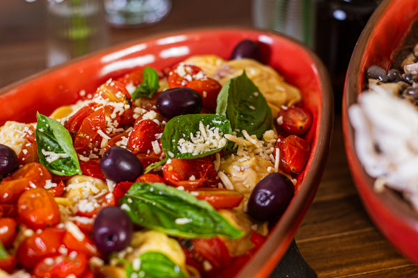 Raviolone de Bacalhau com azeitonas e tomatinhos confit